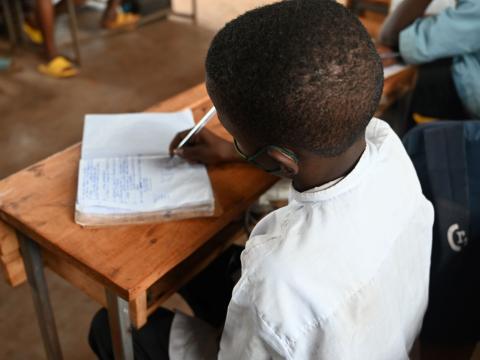 John in his class in Rwanda